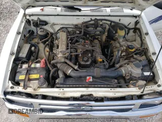1993 Toyota Pickup DLX z VIN JT4RN93P7P5074129, wystawiony jako Copart lot #72893054 z przebiegiem 235 053 mil mil oraz Szkoda całkowita • Salvage title. Historia ofert i sprzedaży dostępna na DreamBid. Obrazek 13.
