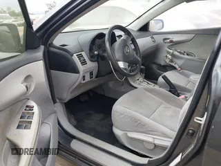 2011 Toyota Corolla L with VIN JTDBU4EE3BJ090749, listed as a IAAI auction lot 42106633 with 209,824 mi miles. Bid and sale history available at carsss.com. Image 5.