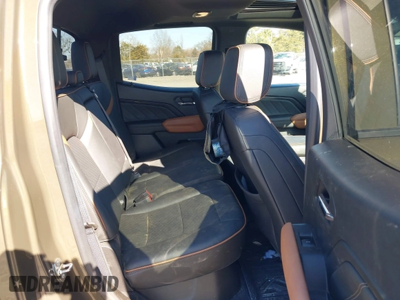 2023 GMC Canyon 4WD AT4 with VIN 1GTP6DEK1P1174713, listed as a IAAI auction lot 41733242 with 35,705 mi miles. Bid and sale history available at carsss.com. Image 8.