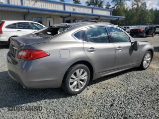 2011 Infiniti M with VIN JN1BY1APXBM325191, listed as a Copart auction lot 74209614 with 136,662 mi miles and Salvage Title. Bid and sale history available at DreamBid. Image 3.
