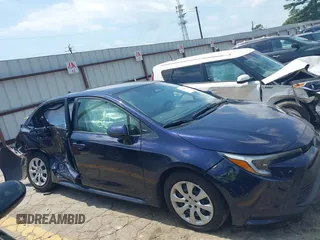 2023 Toyota Corolla Hybrid LE with VIN JTDBCMFE5PJ003037, listed as a IAAI auction lot 40168826 with 50,709 mi miles. Bid and sale history available at carsss.com. Image 13.