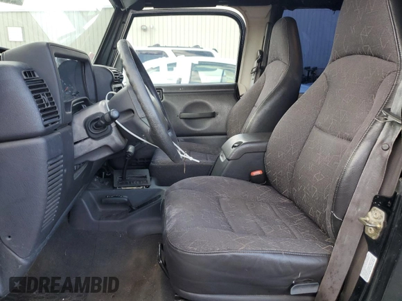 2002 Jeep Wrangler SE with VIN 1J4FA29P82P732805, listed as a Copart auction lot 86017044 with 138,679 mi miles and Salvage Title. Bid and sale history available at DreamBid. Image 7.