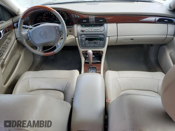 2004 Cadillac DeVille DTS z VIN 1G6KF579X4U212415, wystawiony jako Copart lot #58005555 z przebiegiem 97 663 mil mil oraz Tytuł czysty. Historia ofert i sprzedaży dostępna na DreamBid. Obrazek 8.