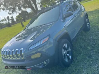 2015 Jeep Cherokee Trailhawk with VIN 1C4PJMBS1FW529559, listed as a Copart auction lot 66581755 with 113,915 mi miles and Salvage title. Bid and sale history available at DreamBid. Image 2.