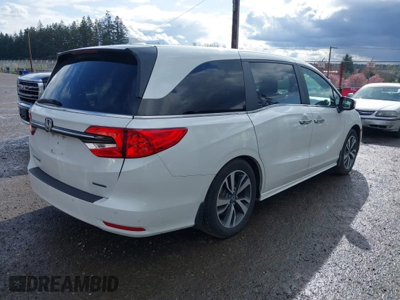 2021 Honda Odyssey Touring with VIN 5FNRL6H87MB015310, listed as a IAAI auction lot 41916339 with 58,808 mi miles. Bid and sale history available at carsss.com. Image 4.