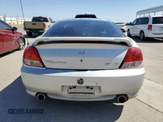 2006 Hyundai Tiburon GT z VIN KMHHN65F26U225506, wystawiony jako Copart lot #56997285 z przebiegiem 170 175 mil mil oraz Szkody całkowita. Historia ofert i sprzedaży dostępna na DreamBid. Obrazek 6.