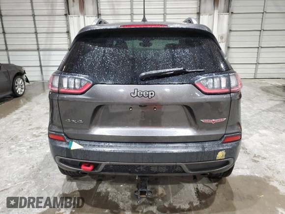 2020 Jeep Cherokee Trailhawk z VIN 1C4PJMBX5LD591873, wystawiony jako Copart lot #54308695 z przebiegiem 34 615 mil mil oraz Szkoda całkowita • Salvage title. Historia ofert i sprzedaży dostępna na DreamBid. Obrazek 6.