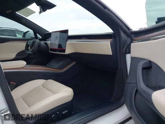2021 Tesla Model S Long Range with VIN 5YJSA1E57MF453815, listed as a IAAI auction lot 41818700 with 51,176 mi miles and . Bid and sale history available at DreamBid. Image 5.