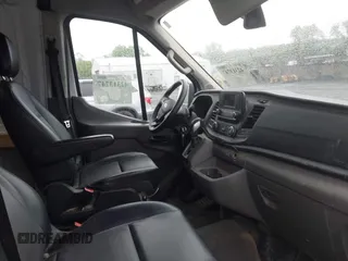 2021 Ford Transit Cargo with VIN 1FTBW1X84MKA98047, listed as a IAAI auction lot 42313747 with 65,600 mi miles and . Bid and sale history available at DreamBid. Image 5.