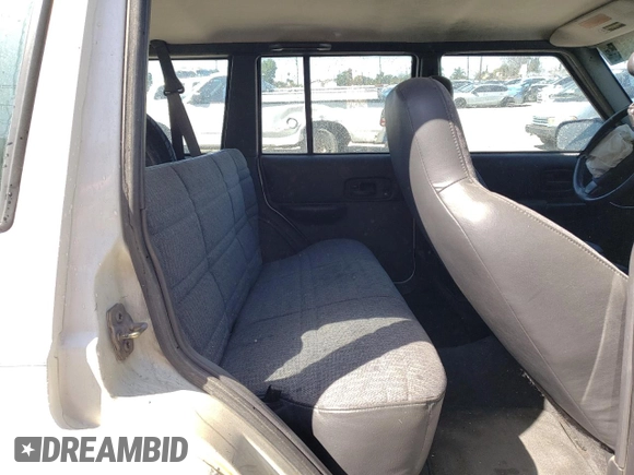 1999 Jeep Cherokee Sport with VIN 1J4FT68S9XL627003, listed as a Copart auction lot 49478595 with 320,444 mi miles and Salvage title. Bid and sale history available at DreamBid. Image 11.