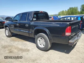 2001 Dodge Dakota Sport z VIN 1B7GG2AN81S113605, wystawiony jako Copart lot #58990065 z przebiegiem 243 919 mil mil oraz Tytuł czysty. Historia ofert i sprzedaży dostępna na DreamBid. Obrazek 2.
