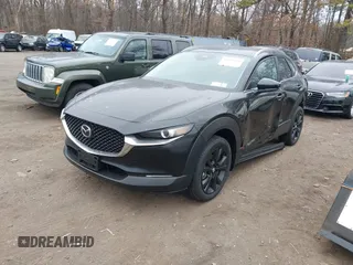 2025 Mazda CX-30 S Select Sport z VIN 3MVDMBBM3SM787607, wystawiony jako IAAI lot #41699529 z przebiegiem 1 920 mil mil oraz . Historia ofert i sprzedaży dostępna na DreamBid. Obrazek 2.