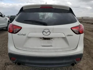 2016 Mazda CX-5 Grand Touring with VIN JM3KE2DYXG0784971, listed as a Copart auction lot 43865605 with 146,025 mi miles and Salvage Title. Bid and sale history available at carsss.com. Image 6.
