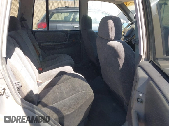 1997 Jeep Grand Cherokee Laredo with VIN 1J4GZ58S3VC603239, listed as a IAAI auction lot 42593915 with 295,696 mi miles and . Bid and sale history available at DreamBid. Image 8.