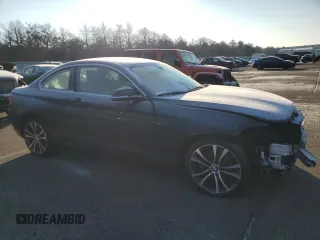 2015 BMW 2 Series 228i xDrive with VIN WBA1F7C50FVX95823, listed as a Copart auction lot 87157134 with 55,312 mi miles and Salvage Title. Bid and sale history available at carsss.com. Image 4.
