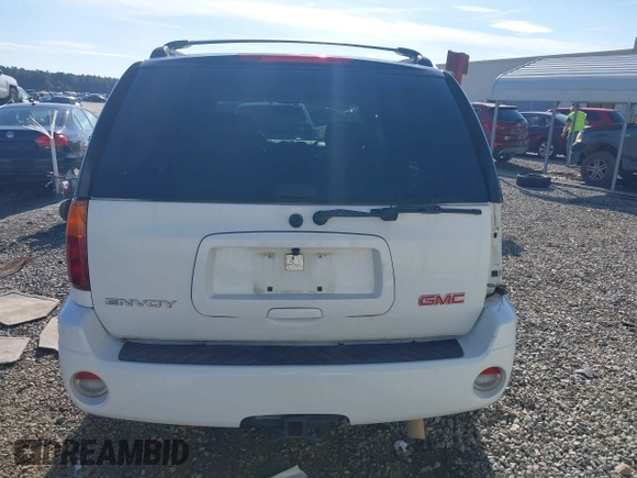 2006 GMC Envoy SLT with VIN 1GKDS13S062128531, listed as a IAAI auction lot 41458983 with 119,385 mi miles. Bid and sale history available at carsss.com. Image 16.