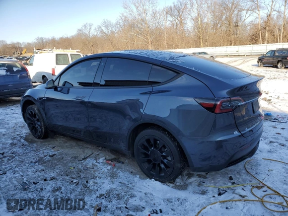 2023 Tesla Model Y Long Range with VIN 7SAYGDEE6PF752570, listed as a Copart auction lot 84927794 with 52,297 mi miles and Salvage Title. Bid and sale history available at DreamBid. Image 2.
