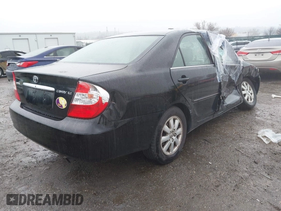 2003 Toyota Camry LE with VIN 4T1BE30K13U144114, listed as a IAAI auction lot 41829879 with 60,385 mi miles and . Bid and sale history available at DreamBid. Image 4.