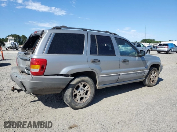 2000 Jeep Grand Cherokee Laredo with VIN 1J4G248S7YC321298, listed as a Copart auction lot 58036255 with 292,779 mi miles and Salvage title. Bid and sale history available at DreamBid. Image 3.