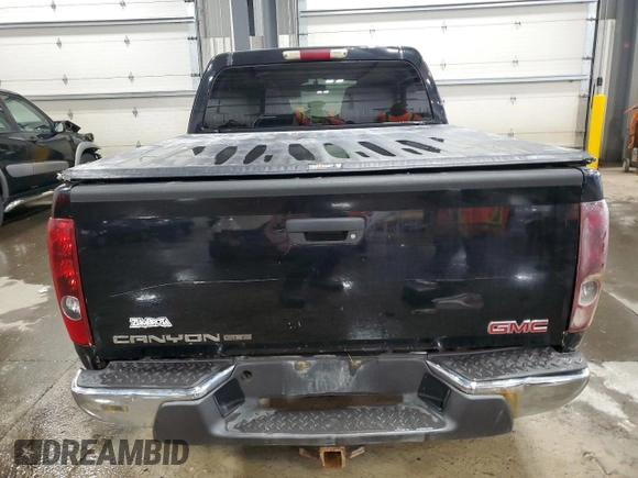 2004 GMC Canyon 1SB SLE Z85 with VIN 1GTDT136348114628, listed as a Copart auction lot 52105615 with 244,232 mi miles and Salvage Title. Bid and sale history available at carsss.com. Image 6.