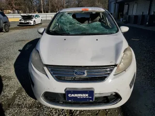 2012 Ford Fiesta SE with VIN 3FADP4BJ3CM101275, listed as a Copart auction lot 85560904 with 101,169 mi miles and Salvage Title. Bid and sale history available at DreamBid. Image 5.
