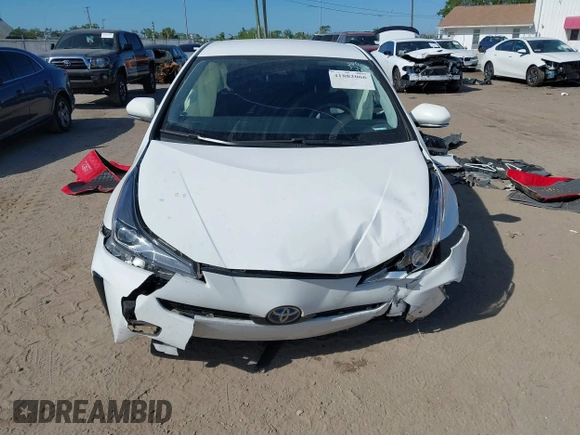 2021 Toyota Prius L Eco with VIN JTDKAMFU2M3147562, listed as a IAAI auction lot 41882066 with 99,491 mi miles. Bid and sale history available at carsss.com. Image 6.