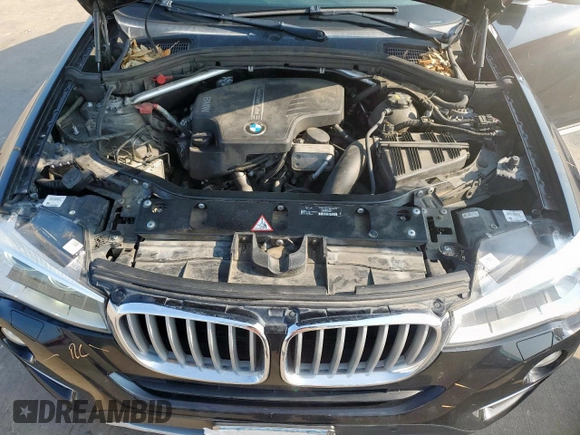 2015 BMW X4 xDrive28i with VIN 5UXXW3C52F0M87621, listed as a Copart auction lot 59176505 with 163,727 mi miles and Salvage title. Bid and sale history available at DreamBid. Image 12.