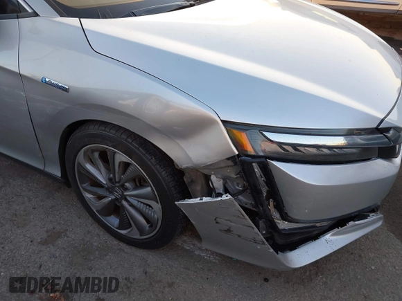 2018 Honda Clarity with VIN JHMZC5F15JC018312, listed as a IAAI auction lot 41354648 with 97,035 mi miles and . Bid and sale history available at DreamBid. Image 6.