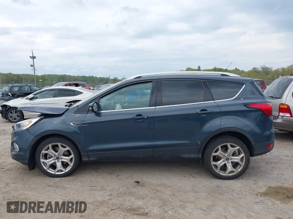 2019 Ford Escape Titanium with VIN 1FMCU9J95KUC19062, listed as a IAAI auction lot 42112188 with 26,100 mi miles. Bid and sale history available at carsss.com. Image 13.