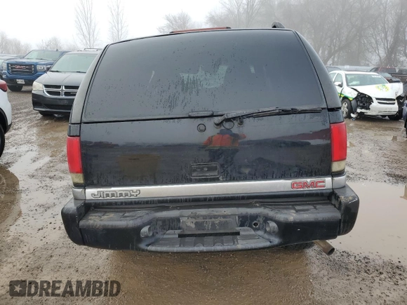 1999 GMC Jimmy SLE with VIN 1GKDT13W3X2522381, listed as a Copart auction lot 83219014 with Not Provided miles and Non Repairable. Bid and sale history available at carsss.com. Image 6.