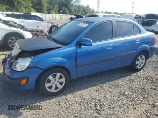 2009 Kia Rio LX with VIN KNADE223296515613, listed as a Copart auction lot 62008194 with 143,238 mi miles and Salvage Title. Bid and sale history available at carsss.com. Image 1.