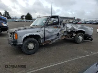 1989 Dodge Dakota S with VIN 1B7GL26X9KS129335, listed as a Copart auction lot 82744003 with 174,152 mi miles and Salvage Title. Bid and sale history available at carsss.com. Image 1.