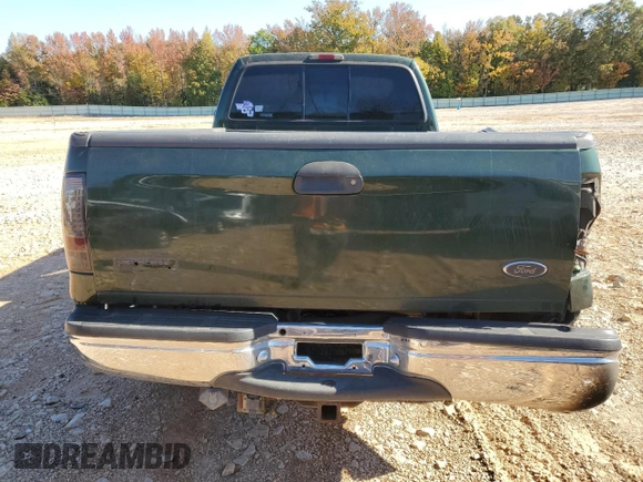 2000 Ford F-350 XL with VIN 1FTSW31F7YEE20820, listed as a Copart auction lot 77496284 with 312,193 mi miles and Salvage Title. Bid and sale history available at DreamBid. Image 6.