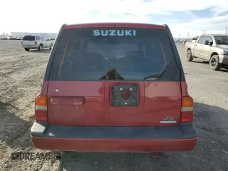 1995 Suzuki Sidekick z VIN JS3TD03V6S4113425, wystawiony jako Copart lot #76973244 z przebiegiem 152 638 mil mil oraz Szkody całkowita. Historia ofert i sprzedaży dostępna na DreamBid. Obrazek 6.
