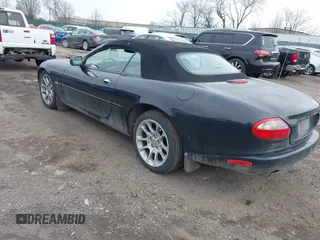 1997 Jaguar XK with VIN SAJGX274XVC017622, listed as a IAAI auction lot 41614339 with 94,298 mi miles and . Bid and sale history available at DreamBid. Image 3.