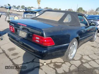 2001 Mercedes-Benz SL-Class with VIN WDBFA68F81F197287, listed as a IAAI auction lot 41442362 with 127,628 mi miles. Bid and sale history available at carsss.com. Image 4.