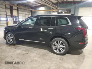 2020 Cadillac XT6 FWD Premium Luxury with VIN 1GYKPCRSXLZ154638, listed as a Copart auction lot 57439835 with 142,435 mi miles and Salvage title. Bid and sale history available at DreamBid. Image 2.