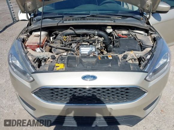 2018 Ford Focus SE z VIN 1FADP3FEXJL210905, wystawiony jako IAAI lot #42264105 z przebiegiem 136 499 mil mil oraz . Historia ofert i sprzedaży dostępna na DreamBid. Obrazek 10.