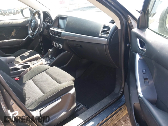 2016 Mazda CX-5 Touring with VIN JM3KE4CYXG0620990, listed as a IAAI auction lot 41978738 with 91,237 mi miles and . Bid and sale history available at carsss.com. Image 5.