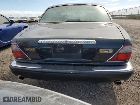 1999 Jaguar XJ with VIN SAJKX6047XC861227, listed as a Copart auction lot 75007414 with Not provided miles and Salvage title. Bid and sale history available at DreamBid. Image 6.