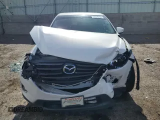 2016 Mazda CX-5 Grand Touring with VIN JM3KE2DY0G0888854, listed as a Copart auction lot 68379754 with 73,096 mi miles and Salvage Title. Bid and sale history available at carsss.com. Image 5.