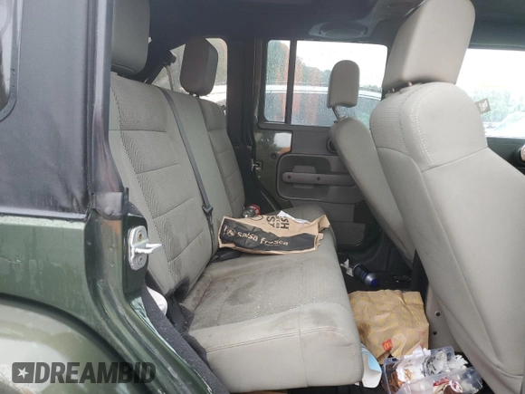 2007 Jeep Wrangler Unlimited Sahara с VIN 1J4GA59107L141710, выставлен на аукционе Copart как лот 59939755 с пробегом 212 659 миль миль и Списание • Salvage title. История ставок и продаж доступна на DreamBid. Изображение 11.
