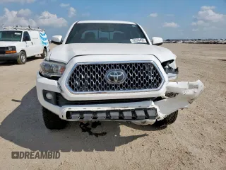 2018 Toyota Tacoma SR z VIN 3TMCZ5AN0JM178886, wystawiony jako Copart lot #56330495 z przebiegiem 71 962 mil mil oraz Szkoda całkowita • Salvage title. Historia ofert i sprzedaży dostępna na DreamBid. Obrazek 5.