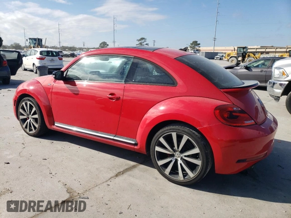 2014 Volkswagen Beetle Turbo R-Line with VIN 3VWVT7AT0EM656599, listed as a Copart auction lot 86358334 with 66,050 mi miles and Salvage Title. Bid and sale history available at DreamBid. Image 2.