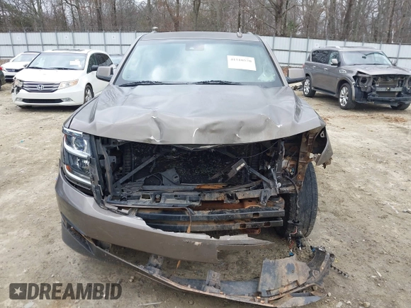 2015 Chevrolet Suburban LT z VIN 1GNSCJKC6FR675585, wystawiony jako IAAI lot #41510570 z przebiegiem 156 818 mil mil oraz . Historia ofert i sprzedaży dostępna na DreamBid. Obrazek 11.