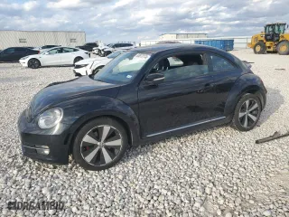 2012 Volkswagen Beetle 2.0T Turbo PZEV with VIN 3VWVA7AT1CM618883, listed as a Copart auction lot 85873174 with 100,482 mi miles and Salvage Title. Bid and sale history available at carsss.com. Image 1.