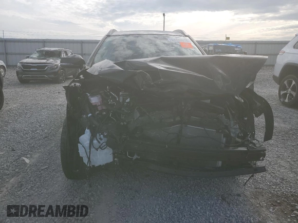 2024 Toyota Corolla Cross XLE with VIN 7MUEAABG2RV108218, listed as a Copart auction lot 54433915 with 7,091 mi miles and Salvage title. Bid and sale history available at DreamBid. Image 5.