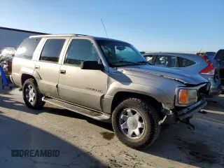 2000 Cadillac Escalade z VIN 1GYEK13R5YR107157, wystawiony jako Copart lot #89024795 z przebiegiem 172 599 mil mil oraz Szkody całkowita. Historia ofert i sprzedaży dostępna na DreamBid. Obrazek 4.