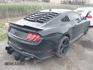 2021 Ford Mustang EcoBoost z VIN 1FA6P8TH7M5132841, wystawiony jako IAAI lot #42364830 z przebiegiem 22 331 mil mil oraz . Historia ofert i sprzedaży dostępna na DreamBid. Obrazek 4.