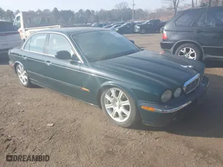 2004 Jaguar XJ with VIN SAJWA71C74SG22814, listed as a IAAI auction lot 41649399 with 114,841 mi miles. Bid and sale history available at carsss.com. Image 1.
